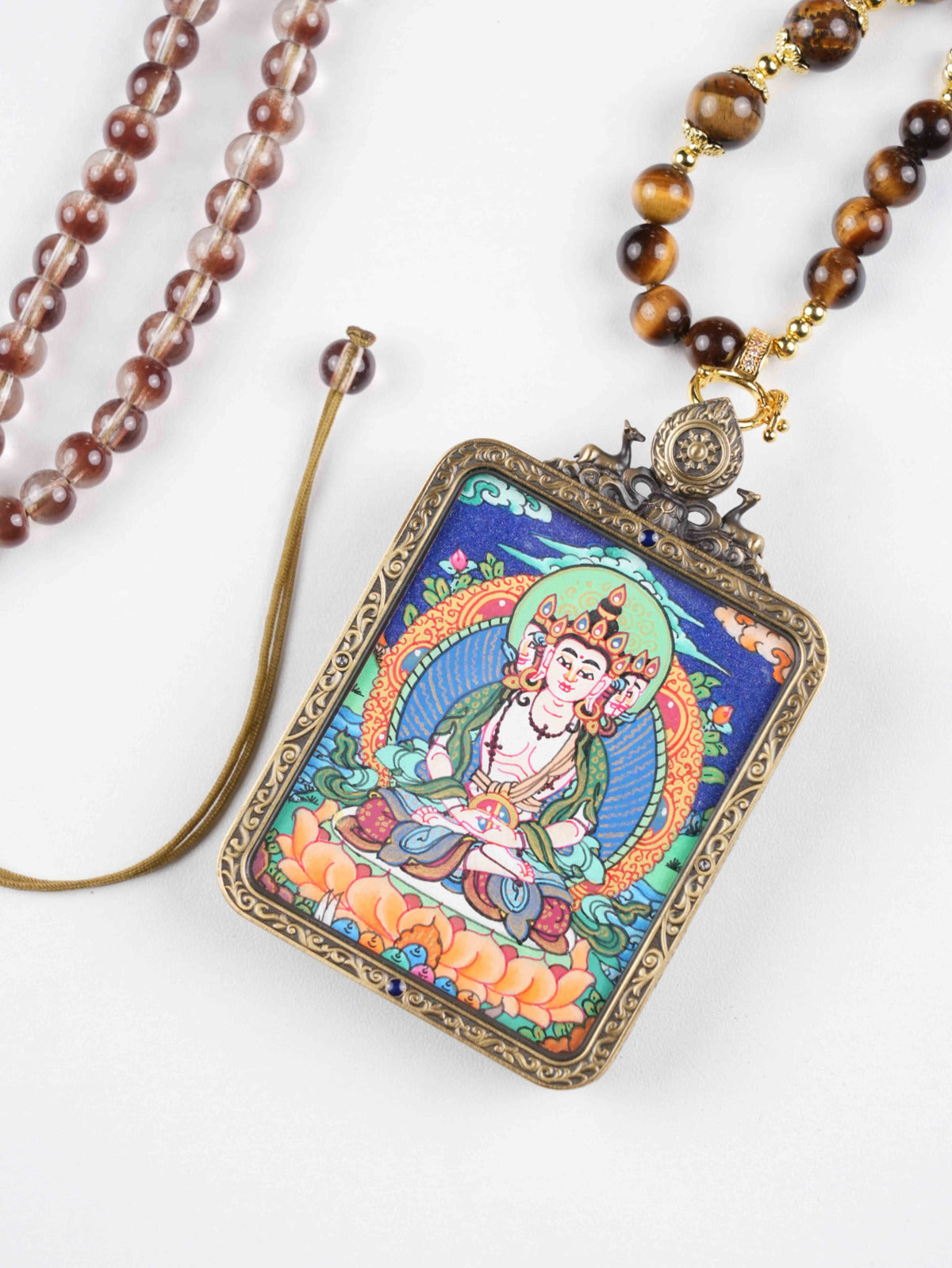 Handmade Vairocana Thangka painting pendant offering protection, clarity, and awakening.
