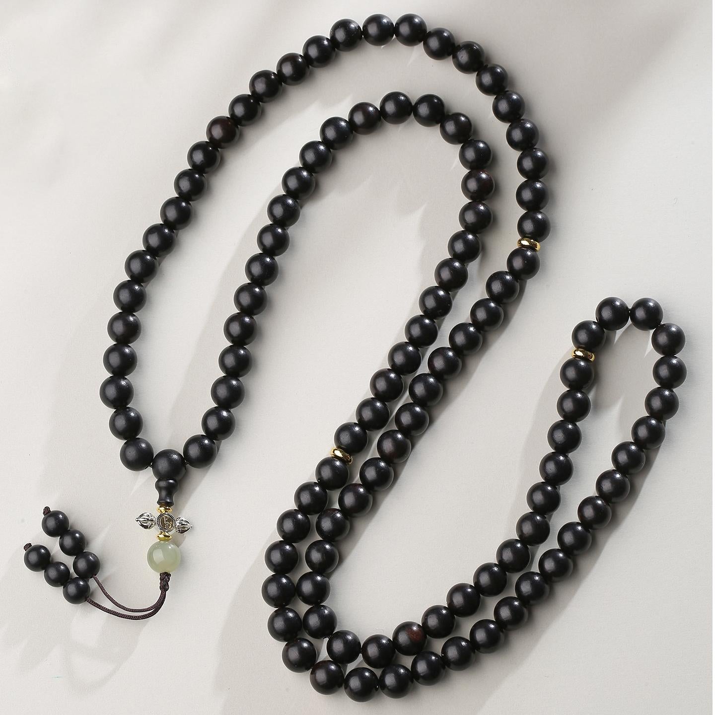 Tibetan meditation necklace crafted from ebony beads and jade details