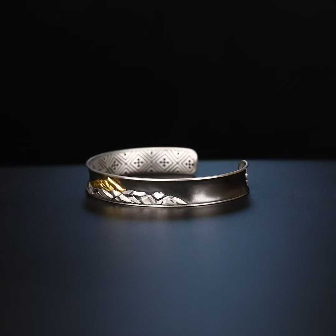 Himalayan Everest spiritual bracelet made of pure gold and silver with exquisite handmade artistry.