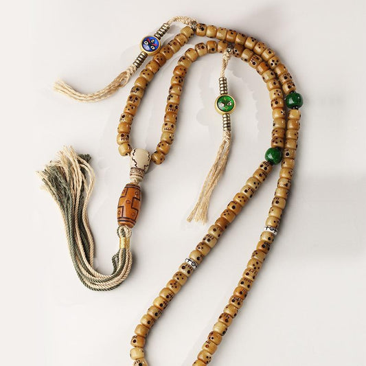 Handmade Tibetan Buddhist necklace with incense ash beads and ox bone design