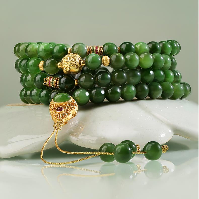 Handmade 108 green jade beads mala with 925 silver gourd charm, representing prosperity and longevity.