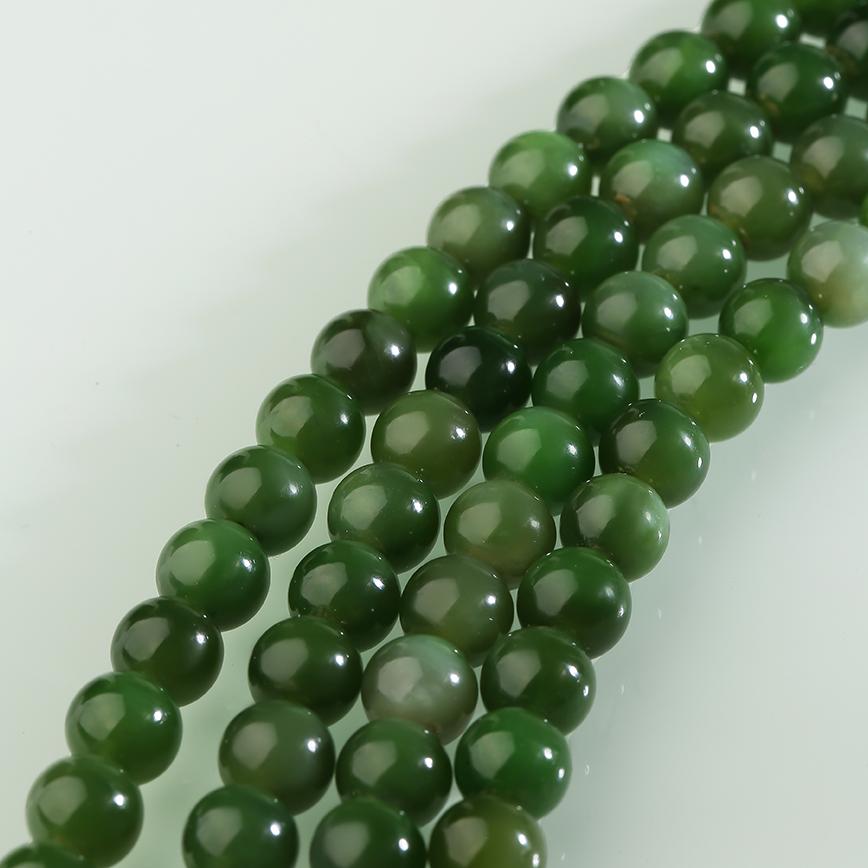 Tibetan Buddhist jade mala necklace with sterling silver fittings, crafted for balance and mindfulness.