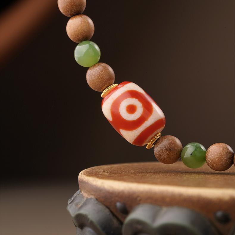 Tibetan-Buddhist 108-bead Laosandal mala necklace with jade, agate, and silver accents for meditation and mindfulness