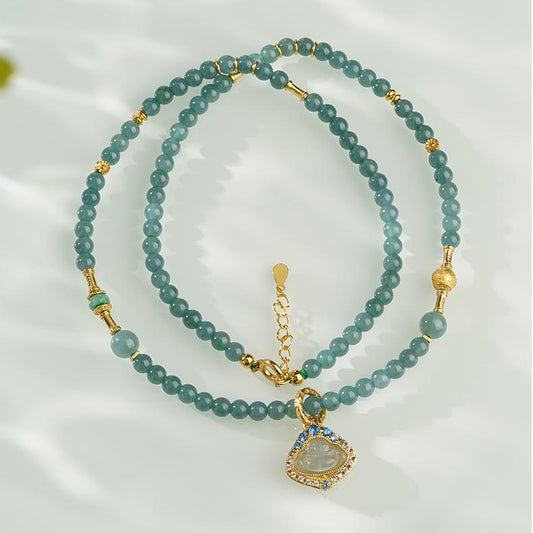 Handcrafted Tibetan Jade Buddha Necklace made with natural jade and s925 silver.