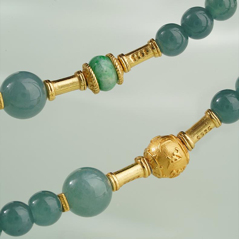 Elegant Tibetan jade necklace with silver details, representing harmony and spiritual protection.