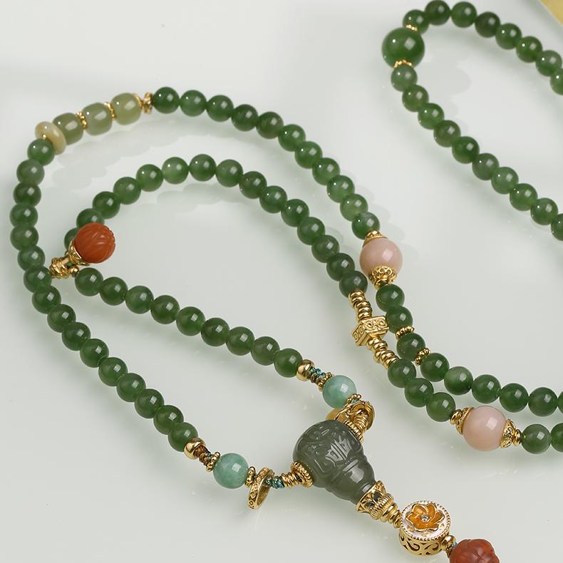 Elegant handmade necklace featuring jade, jadeite, and silver, inspired by Tibetan Buddhist art and blessing energy.