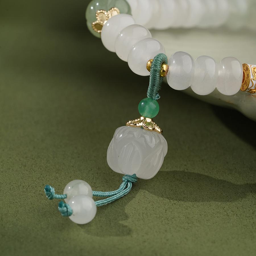 Golden Silk Jade gourd harmony bracelet featuring perfectly balanced gourd beads in Tibetan Buddhist style. This balanced jewelry art piece promotes energetic harmony and emotional equilibrium through its symmetrical design and carefully selected quartzite jade stones.