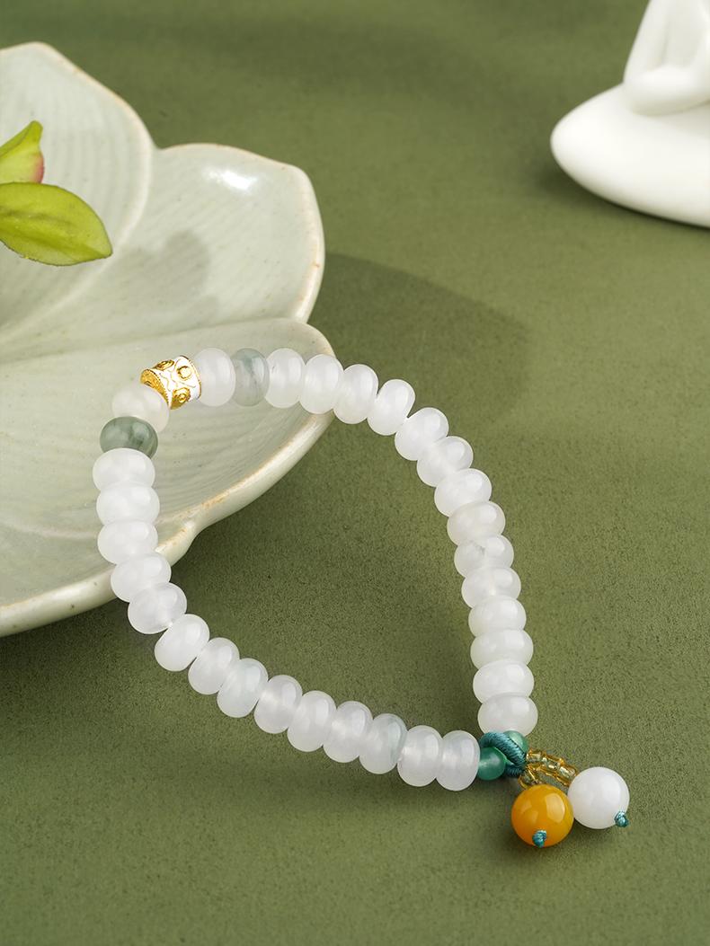 Traditional Golden Silk Jade gourd protection bracelet believed to ward off negative energies in Tibetan culture. This traditional jewelry art piece combines protective symbolism with exquisite craftsmanship.