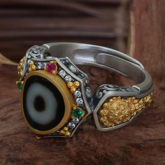 Hand-painted silver 3D Shitoulin Guardian One-Eye ring inspired by Tibetan Buddhist Jewelry Culture, a unique jewelry art piece symbolizing protection and spiritual strength.