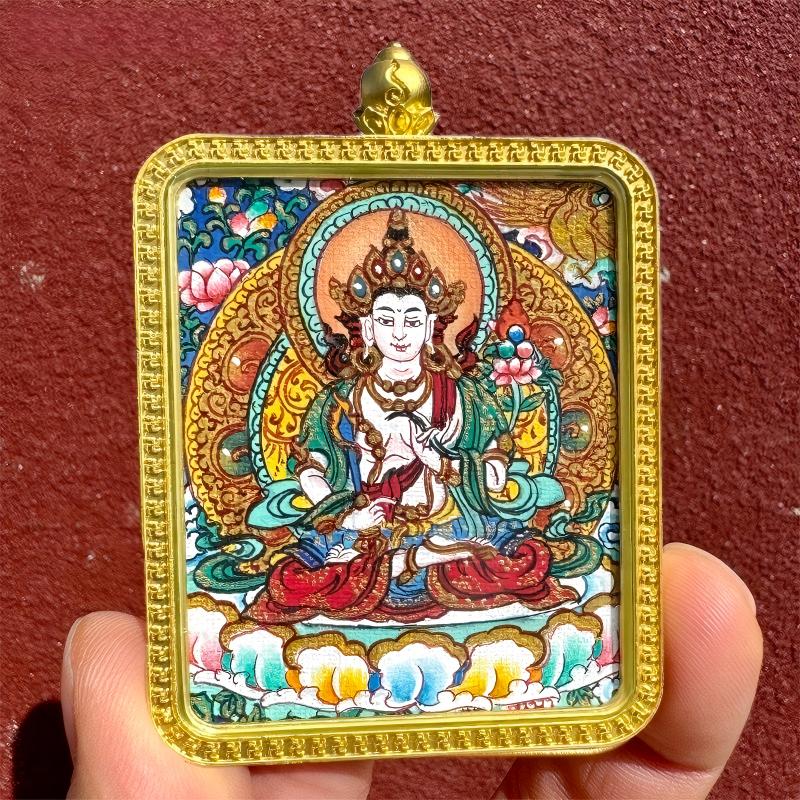 Pure handmade Tibetan Buddhist Thangka pendant depicting guardian deities including Yellow Jambhala, Green Tara, and Amitabha, combining traditional craftsmanship with jewelry art.