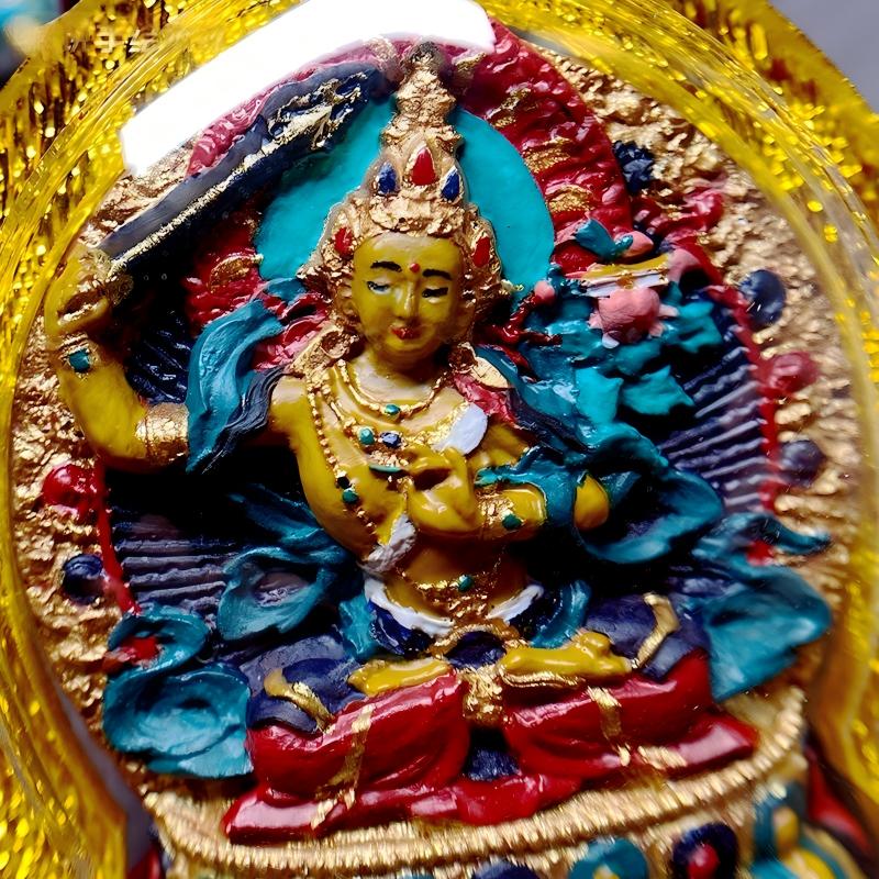 Tibetan Buddhist Jewelry Culture handcrafted Manjushri thangka amulet pendant, miniature tsatsa jewelry art for mindfulness, knowledge, and protection