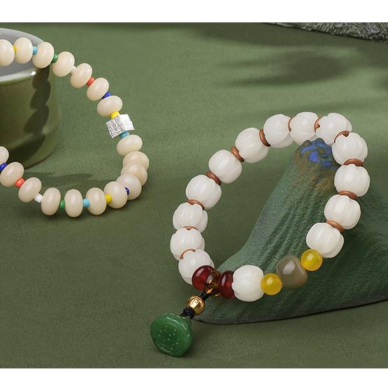 A paired product shot of both the QIanlan and Qionggu Bodhi seed bracelets together. This set represents a complete collection of masterful handcrafted jewelry art, displaying the beautiful contrast between light and dark tones in Tibetan Buddhist accessories.