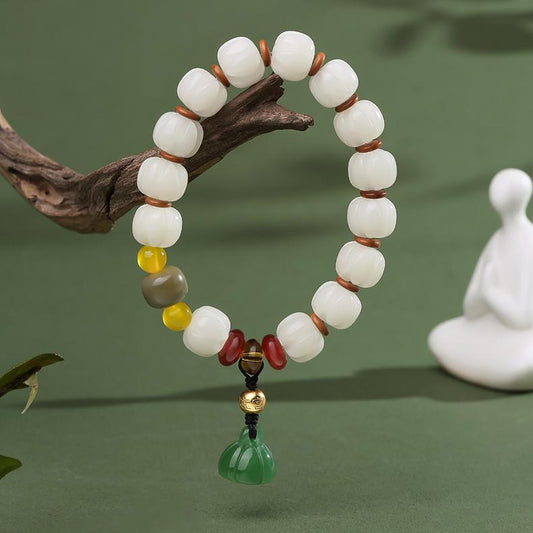 A strand of Qionggu Bodhi seed mala bracelet, showcasing deep, ancient-style beads. This authentic handmade jewelry art piece is crafted for meditation and prayer, offering a tactile and spiritual experience rooted in Tibetan Buddhist traditions.