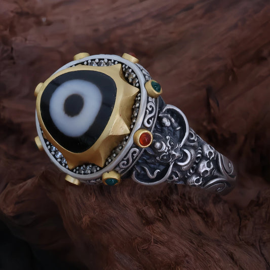 Hand-carved silver Peng Bird One-Eye ring from Tibetan Buddhist Jewelry Culture, showcasing exquisite jewelry art craftsmanship.