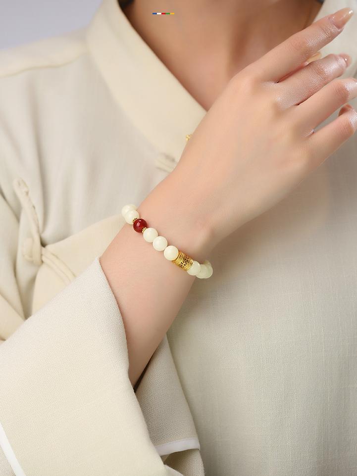 Jingchuning artisanal Bodhi bracelet with red agate accents and 925 silver Potala barrel bead