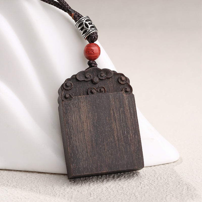 Handcrafted agarwood talisman necklace offering tranquility and good fortune.