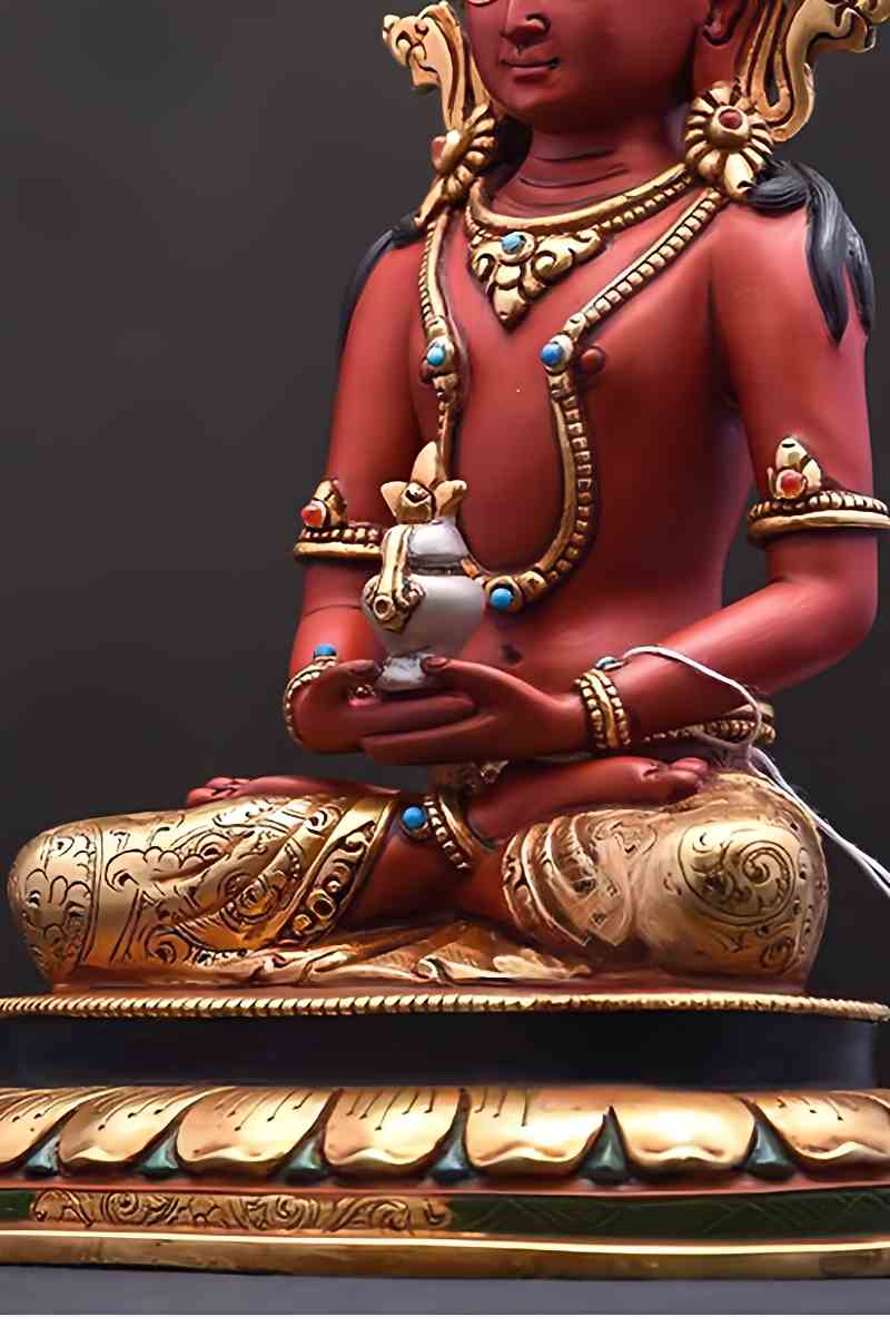 Handmade Tibetan Buddhist Amitayus statue crafted from gilded brass and painted with natural mineral pigments, representing Buddhist art tradition.