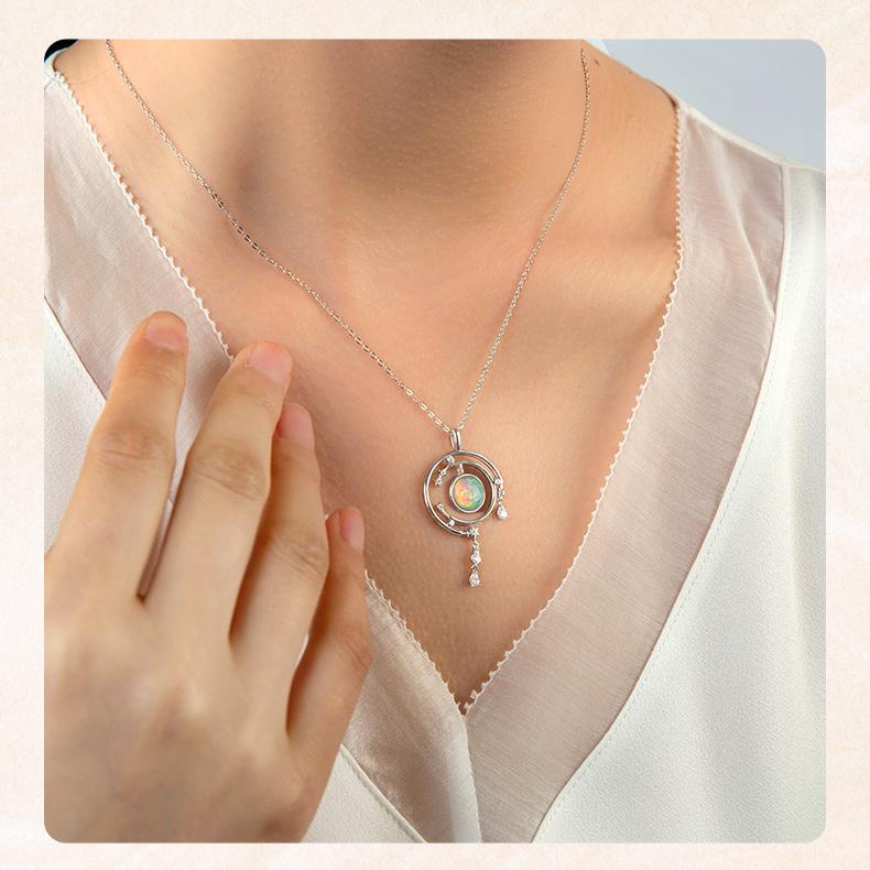 Lotus and moonlight-inspired opal enamel earrings handcrafted in Tibetan Buddhist style.