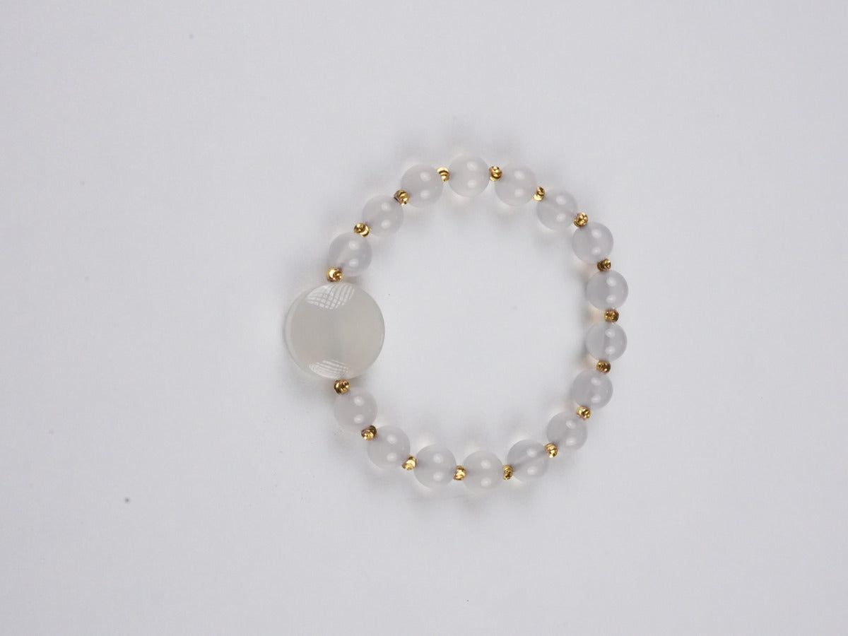 Pure handmade Tibetan Buddhist White Tara thangka bracelet featuring sacred Buddha art with fine mineral pigment details.