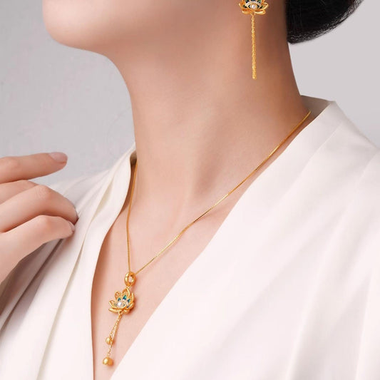 Tibetan Buddhist lotus eye necklace in sterling silver and shell pearl, representing protection, wisdom, and enlightenment.