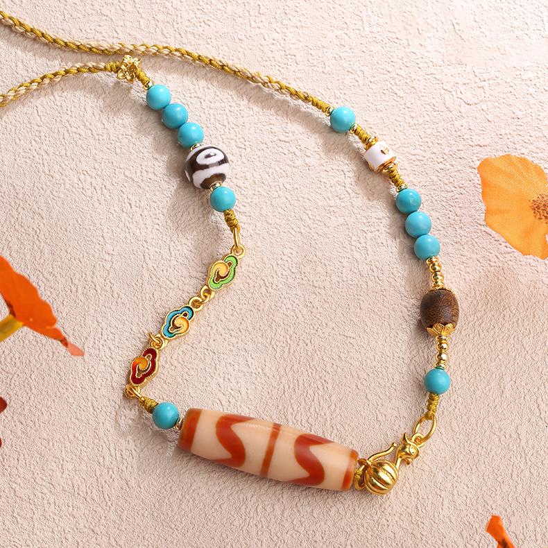 Artisan-crafted Tibetan Buddhist necklace featuring tiger tooth Dzi and copper beads.