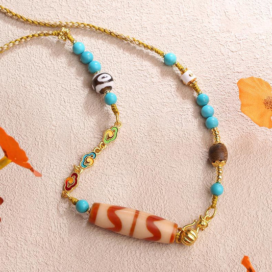 Artisan-crafted Tibetan Buddhist necklace featuring tiger tooth Dzi and copper beads.