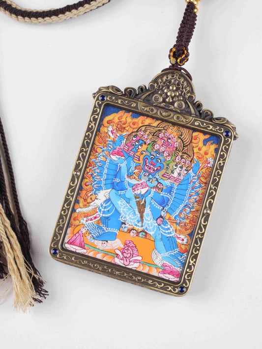 Hand-painted Tibetan Mahasamvara Thangka Gau pendant representing supreme protection and spiritual power.