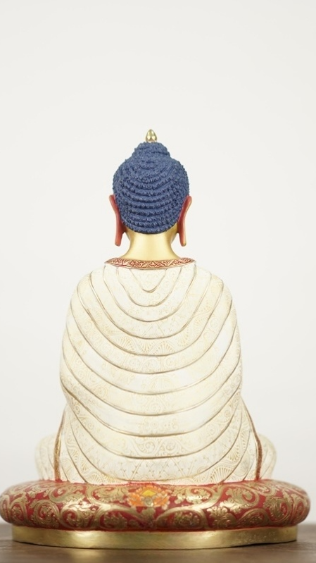 Handcrafted Tibetan Buddhist Maitreya Buddha statue finished with mud-gold detailing and mineral pigments, symbolizing joy, compassion, and future enlightenment.