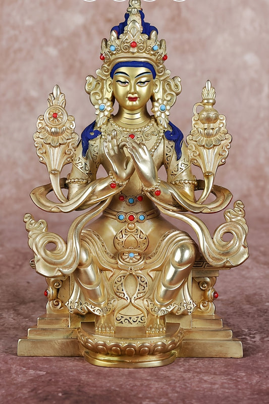 Handcrafted Tibetan Maitreya Buddha statue in yellow brass with vibrant painted details, symbolizing Buddhist culture