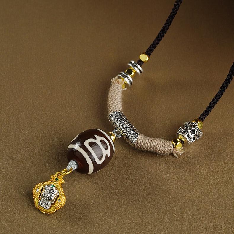 Adjustable ethnic bohemian necklace with a sacred Dzi bead charm, perfect for spiritual fashion.