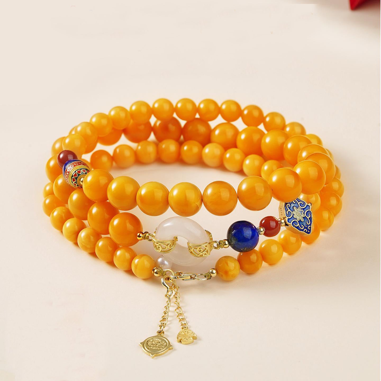 Tibetan Buddhist amber necklace with lapis lazuli and jade, handmade for mindfulness and prosperity.