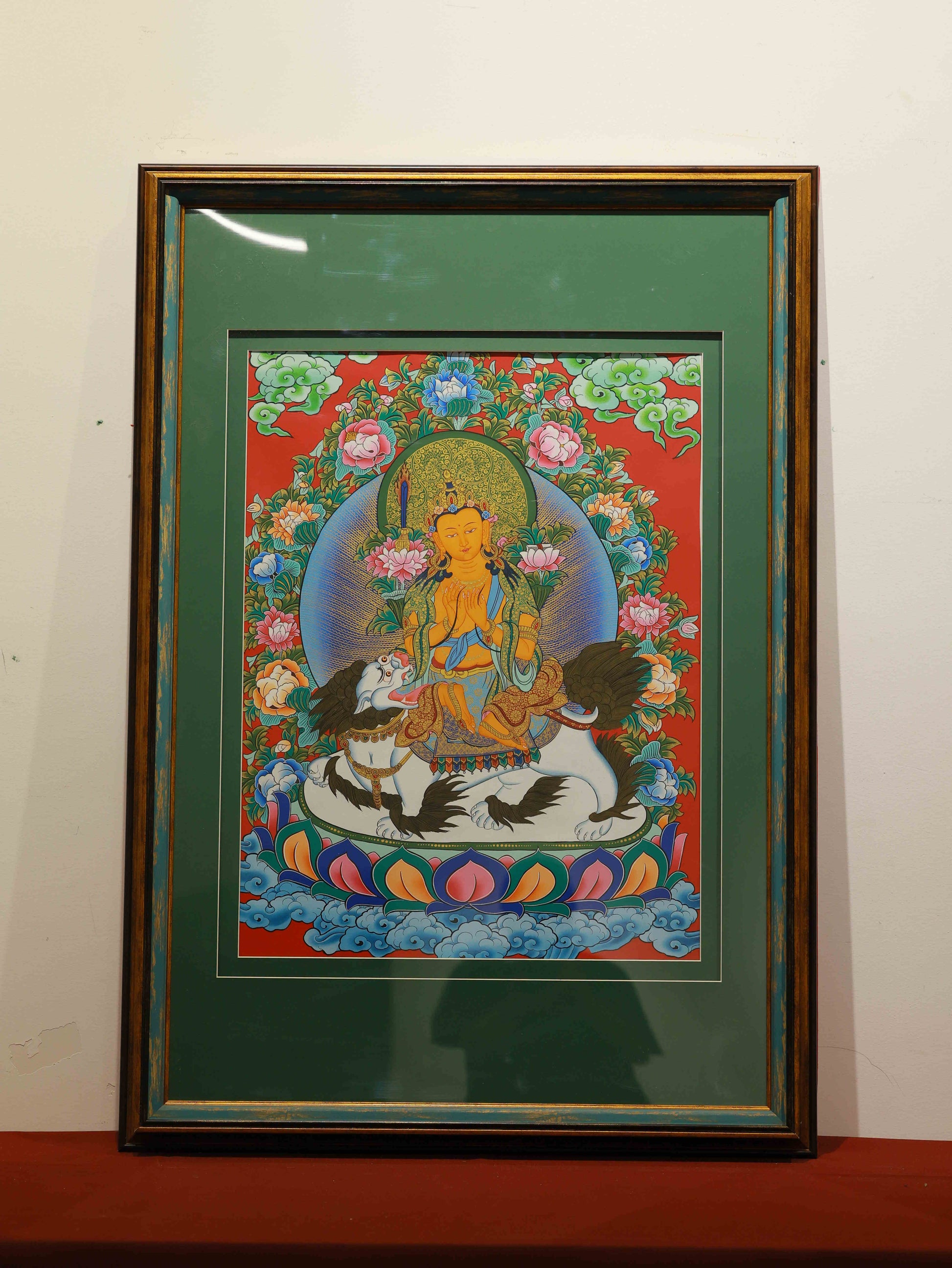 Hand-painted Tibetan Thangka of Manjushri Bodhisattva on canvas, representing wisdom and enlightenment.