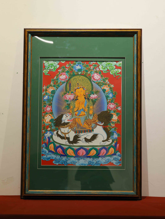 Hand-painted Tibetan Thangka of Manjushri Bodhisattva on canvas, representing wisdom and enlightenment.