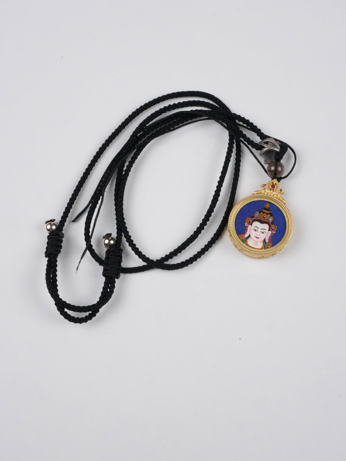 Manjushri thangka pendant with mineral pigments - authentic craftsmanship for wisdom and learning