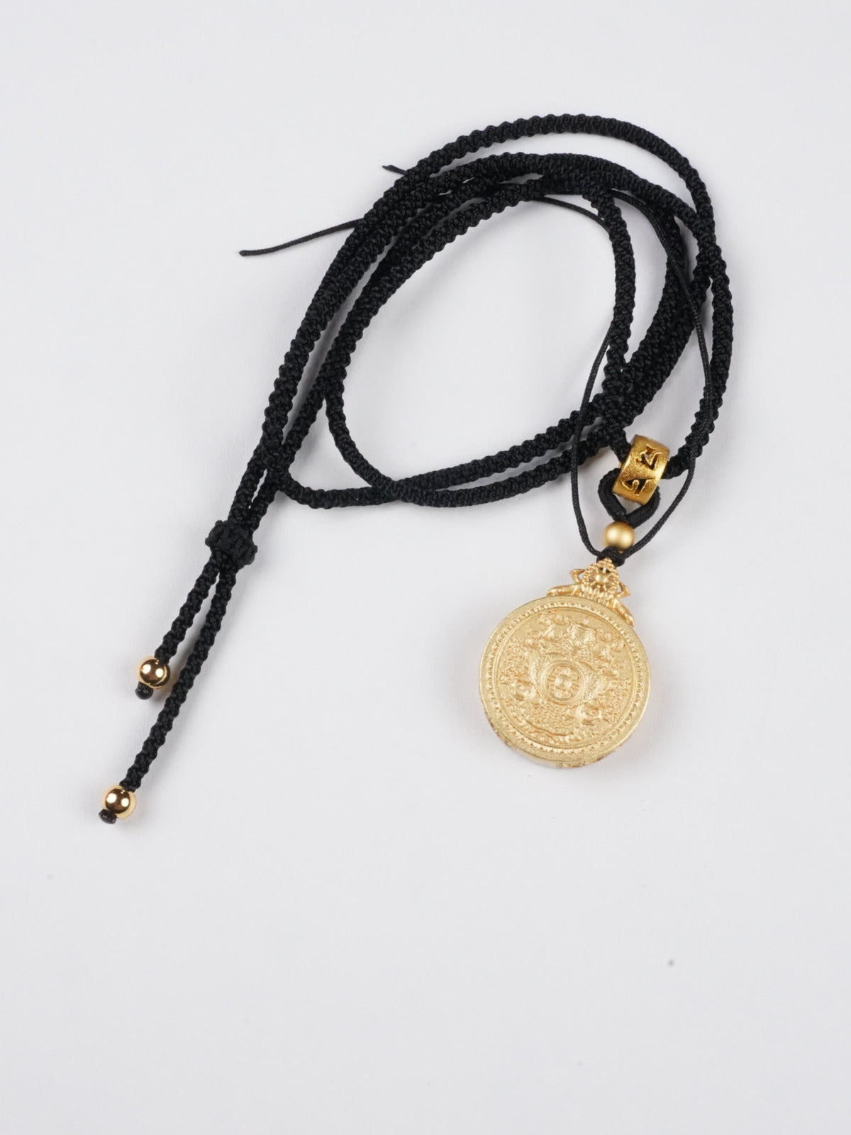 Medicine Buddha thangka pendant with mineral pigments - authentic craftsmanship for healing energy