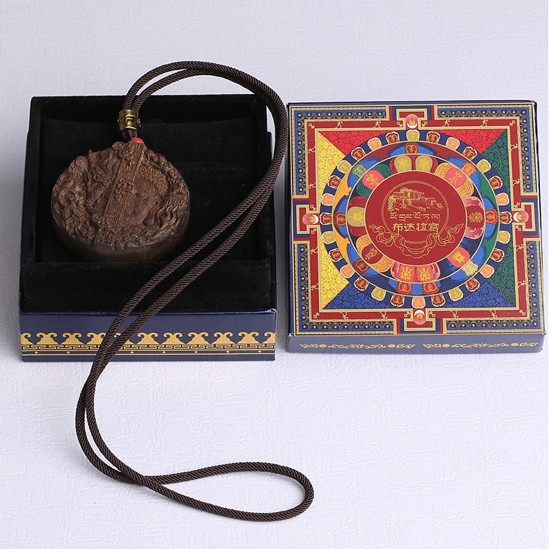 Spiritual Tibetan Buddhist agarwood sandalwood ornament with vermilion bead, ideal for daily wear.