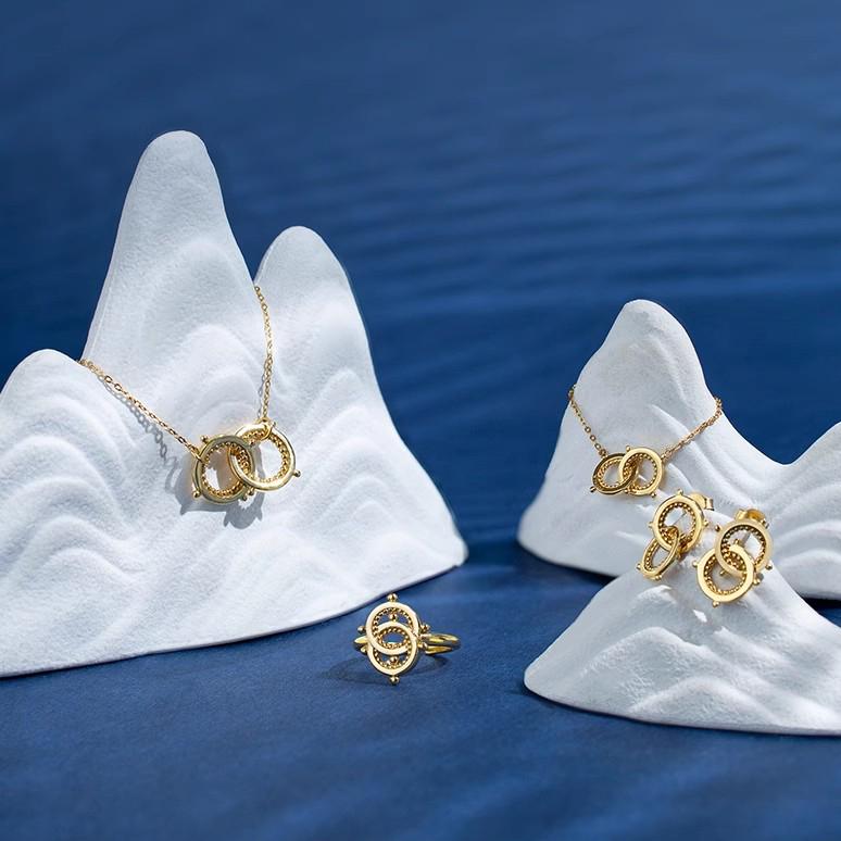 "Tibetan Buddhist 18K gold-plated earrings with a handmade design, representing mountain-water connection and lasting friendships."