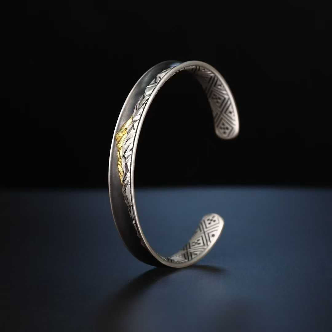 Fine handcrafted Tibetan Buddhist Everest bracelet combining pure gold, silver and sacred symbolism.