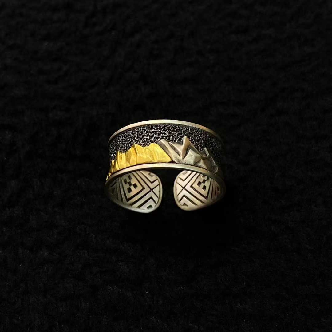 Handcrafted Namjagbarwa mountain ring made of solid gold and silver with fine inlay craftsmanship.