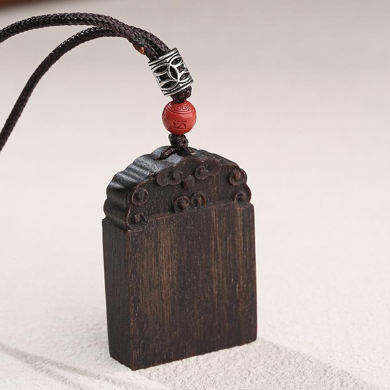 Natural Kyara agarwood pendant reflecting Buddhist harmony and balance.