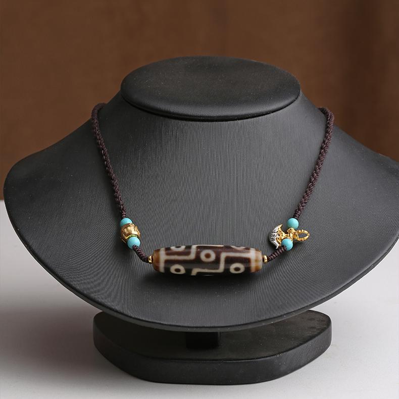 Handmade Dzi amulet pendant with turquoise, agate, and 925 silver.