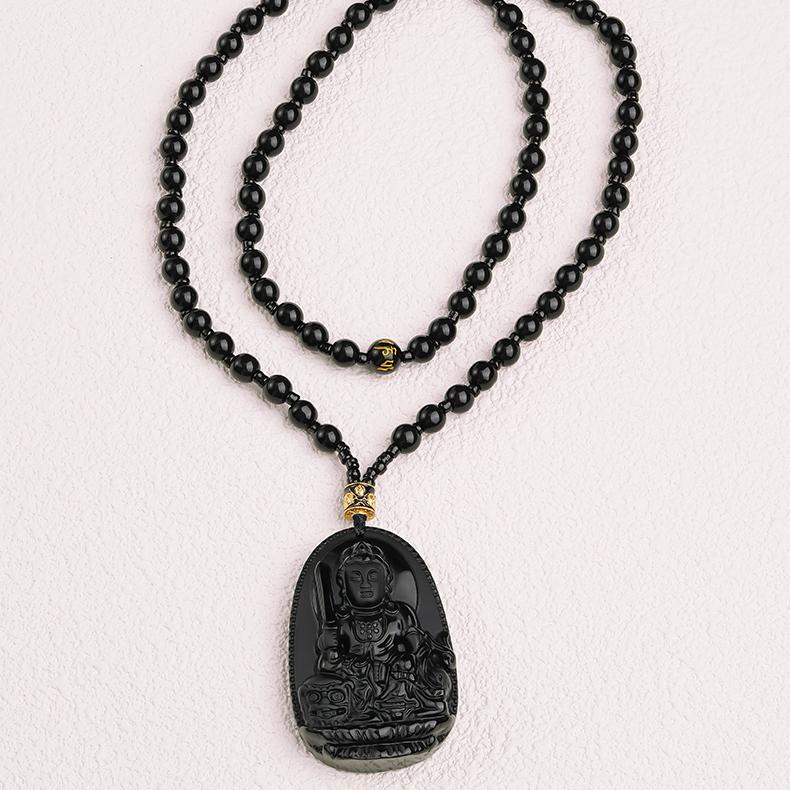 Artisan obsidian necklace inspired by Tibetan Buddhist jewelry art and craftsmanship.
