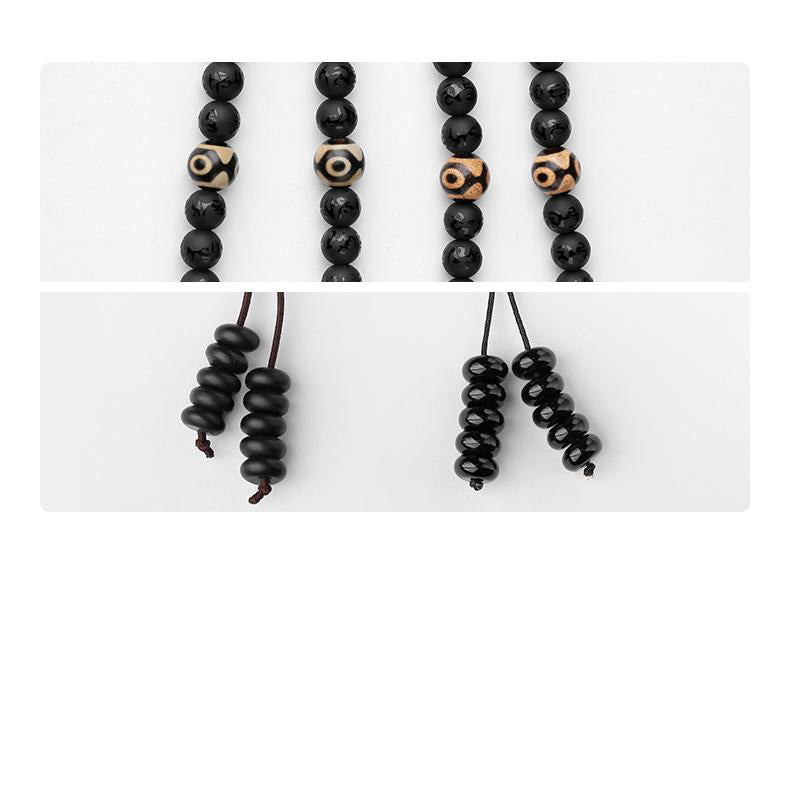 Handcrafted Tibetan Buddhist obsidian mala necklace with 108 beads and pendant art.