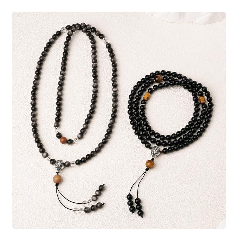 Tibetan Buddhist obsidian mala necklace combining white crystal sandalwood and 925 silver components