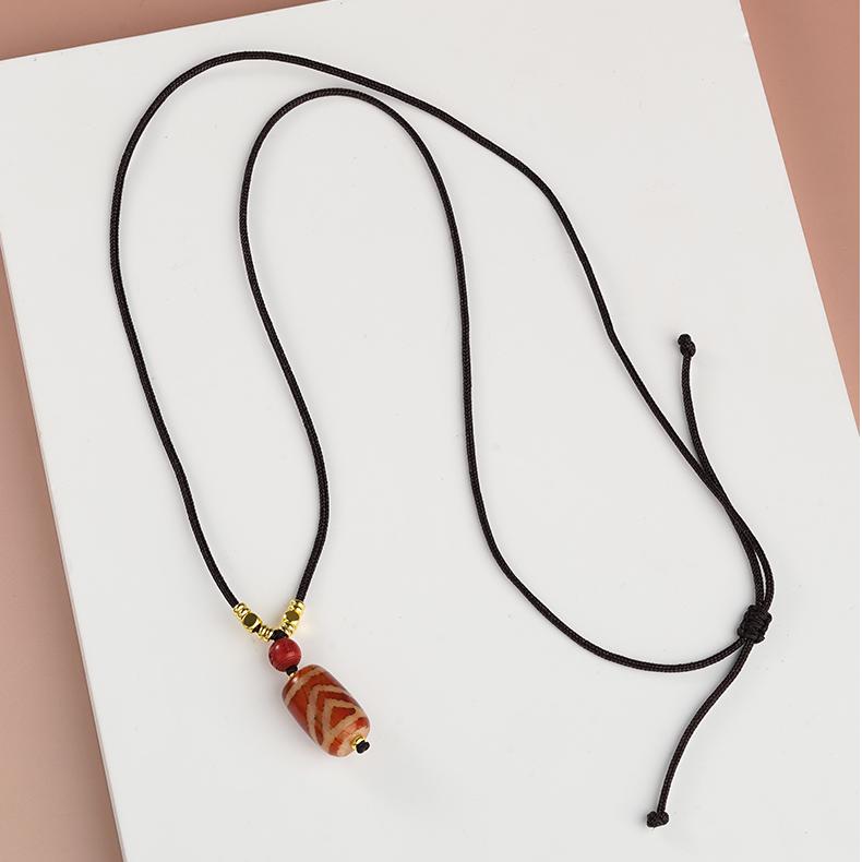 Tibetan Buddhist One-Eye Mountain Support Dzi Pendant made from red agate and potent cinnabar.