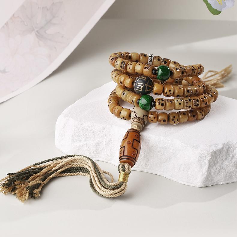 Tibetan Buddhist 108 beads ox bone mala necklace featuring artistic pendant craftsmanship