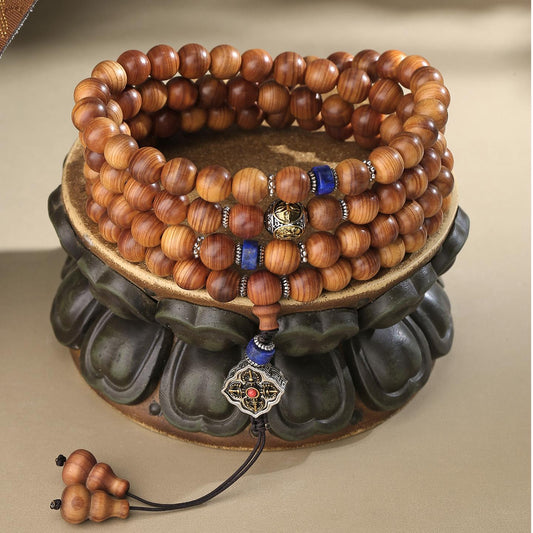 Cypress mala with lapis stone accents for peace, intuition, and sacred energy.