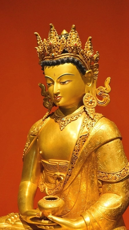Alt Text: Handcrafted Tibetan Buddhist Buddha statue with gilded crown and spiritual symbolism. Perfect for enhancing your meditation and sacred space with positive energy.