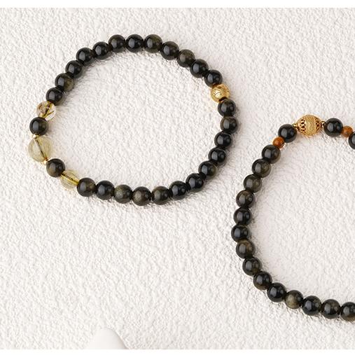 Artisanal Tibetan-Buddhist Golden Obsidian bracelet Qixingli with symbolic silver beadwork