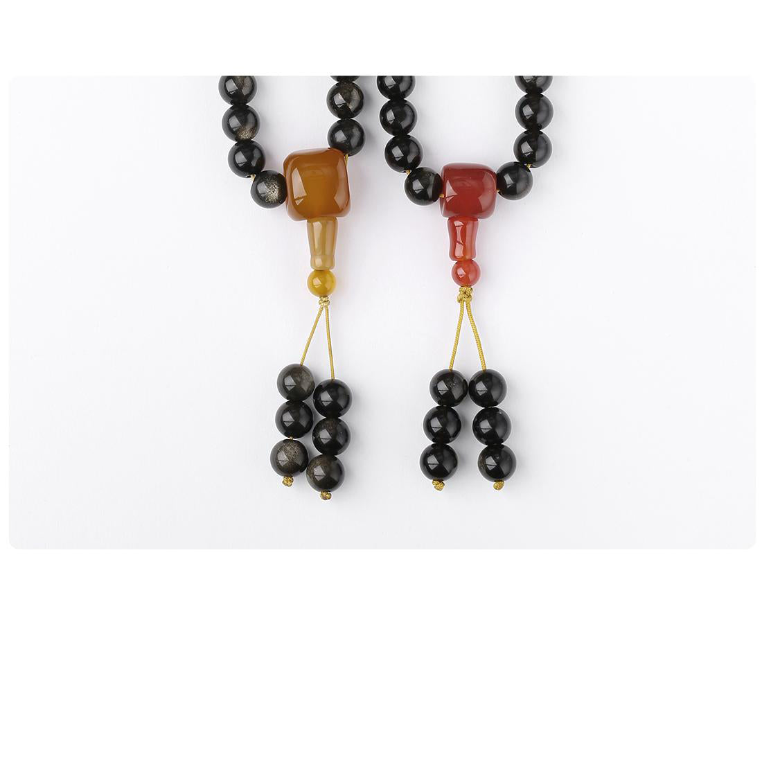 Tibetan-inspired handmade rainbow obsidian and agate mala featuring 108 stones and silver accents.